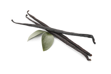 Aromatic vanilla pods and leaves isolated on white