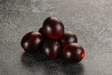 Raw ripe black kumato tomato