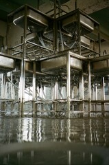 Metal sinks with water running 