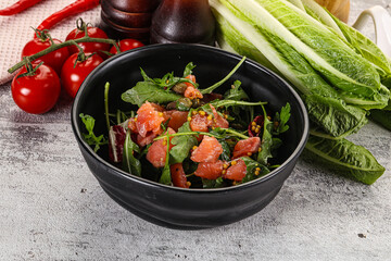 Salad with salmon and arugula