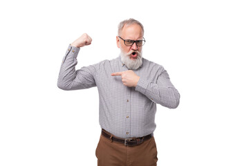 a gray-haired mature man with a beard and mustache in trousers and a shirt is emotionally annoyed