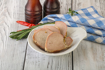 Baked pork tenderloin served rosemary