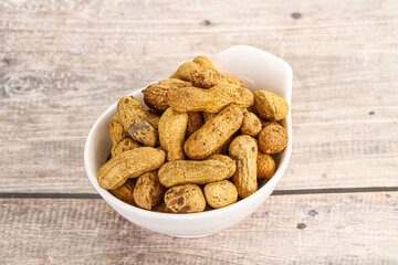 Raw ripe unpeeled peanut heap