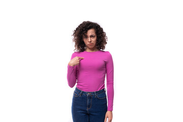young successful leader woman with black hair is dressed in a purple sweater on a white background