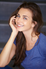 Fototapeta premium Portrait, woman and fashionl with a smile, relax and casual outfit with glow, beautiful lady and peaceful. Face, person and girl with happiness, pose and long hair with a break, clothes and trendy