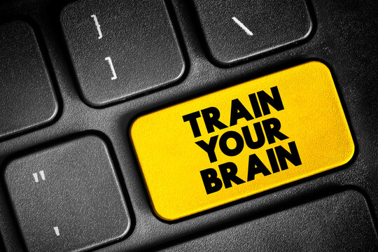 Train Your Brain text button on keyboard, concept background