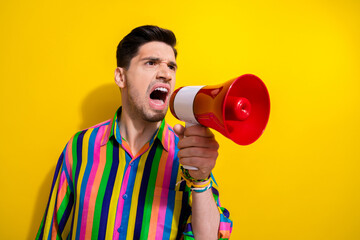 Photo of dissatisfied boss in striped shirt screaming into megaphone announce bad news in company...