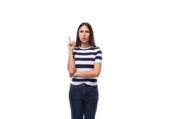 young slender European woman with black straight hair wearing a striped black and white T-shirt...