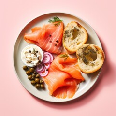 A plate of smoked salmon, cream cheese, and bagel with capers and red onion