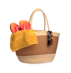Stylish straw bag with beach objects isolated on white