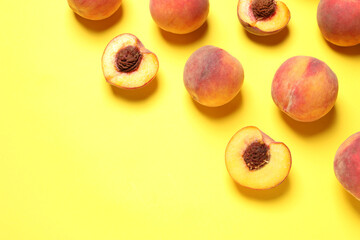 Delicious juicy peaches on yellow background, flat lay. Space for text