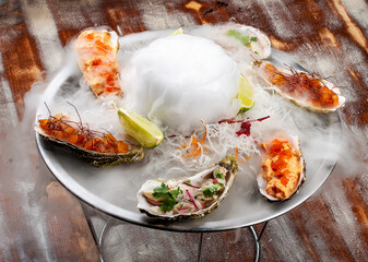 Trio Ceviche, marinated seafood dish, scallop, sea bass, tuna. Haute cuisine. On a wooden background.