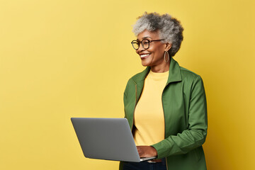 Smiling elderly African American IT woman 50s years old wears jacket white t-shirt hold closed...