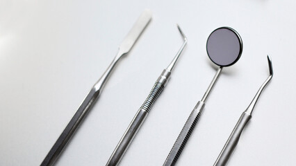 Dental tools on silver color background