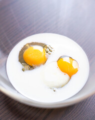  Close-Up of Eggs and Milk Ready to Mix in Glass Bowl