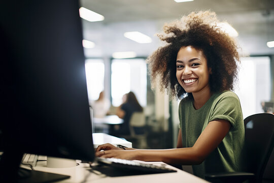 black woman in a green shirt working at a computer desk, with others in the background, in an office setting, ai generative