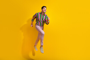 Fototapeta na wymiar Full body size photo of boyfriend jump hurry up more party after day job time wearing retro clothing isolated on yellow color background