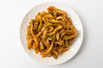 Seasoned zhacai pickles on white background