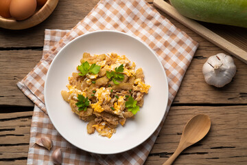 stir fried winter melon(Wax Gourd) and Egg with Oyster sauce in white plate.Top view