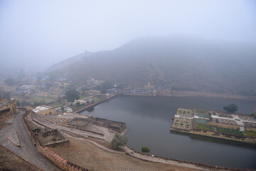 Naklejka premium Mist and fog over the safron garden of Amer fort in Rajsthan.