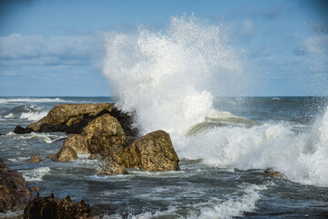waves crashing on rocks in the west African coast