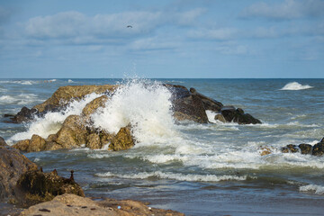 wave breaking on the rocks on the Atlantic coast with waves crashing on rocks
