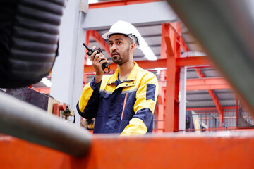 Engineer or employee working in an industrial factory.