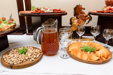 Alcoholic drinks on the buffet table during the celebration of the event