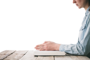 Woman reading and praying over Bible