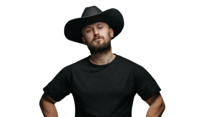 Handsome cowboy wearing black cowboy hat with beard