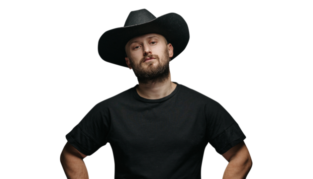 Handsome cowboy wearing black cowboy hat with beard