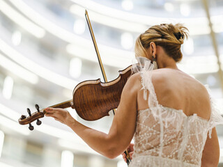 a woman playing the violin