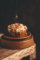 Chocolate caramel muffin on a dark background.
