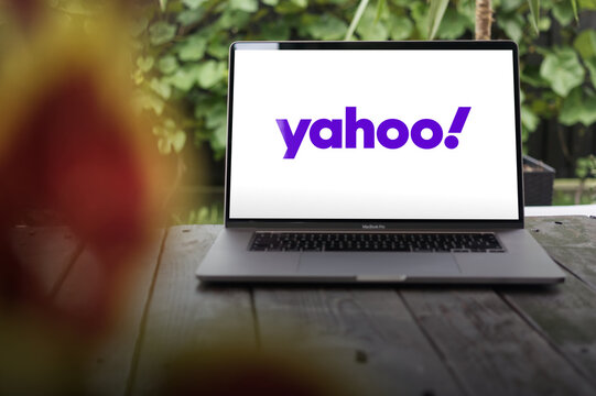 Yahoo! logo, American web portal, search engine, and related services, displayed on MacBook Pro screen