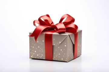  a gift box with a red ribbon and a bow on the top of it, sitting on a white surface, with a reflection of the present in the middle of the box.