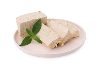 Plate with pieces of tasty halva and mint isolated on white