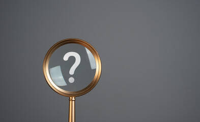 Magnifying glass and question mark. Curiosity, inquiry, uncertainty. Search for answers, clarity,...