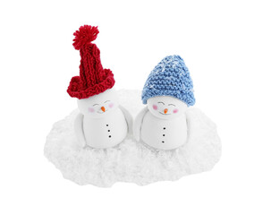 Cute decorative snowmen and artificial snow isolated on white