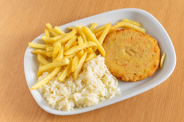 Vibrant vegetarian burger, golden fries, and rice in a cozy diner setting. Savory delights at a local snack bar. Irresistible veggie feast!