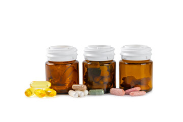 Vitamins and supplements. Variety of vitamin tablets in a jar isolated on white background.Multivitamins with fresh and healthy fruits.Food supplements. 