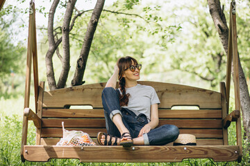Fototapeta premium Woman with eco bag with fruit in a country side