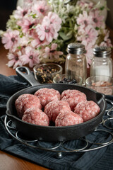Fresh raw pork meatballs with spices