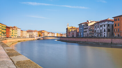 Pisa, Arno river and Ponte di Mezzo bridge. Lungarno view. Tuscany, Italy