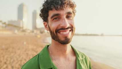 Close-up of young guy looking at the camera with smile