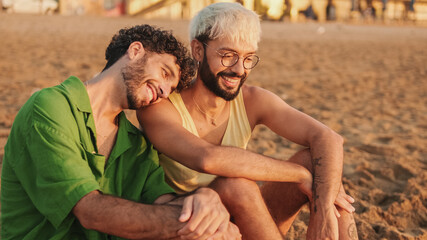 Romantic moments, homosexual couple enjoying intercourse with each other while sitting on the beach...