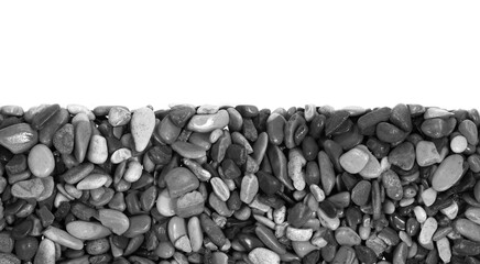 Black pebbles isolated on white background. dark natural aquarium soil. beach pebbles texture close...