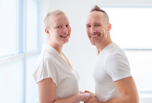 woman with Breast cancer in a bright room with her boyfriend