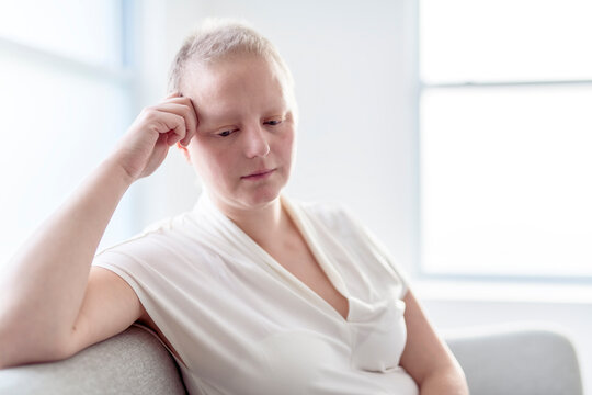 Sad woman with Breast cancer in a bright room
