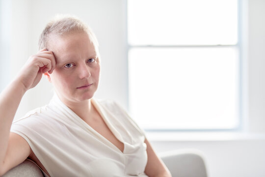 Sad woman with Breast cancer in a bright room