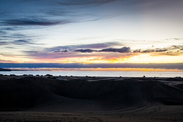 Fototapeta na wymiar Sunrise over the Atlantic Ocean. Shot from the Dunes of Maspalomas Gran Canaria